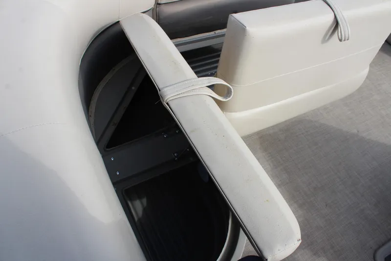 Slide: The Image of 2022 Sun Tracker Party Barge 18 DLX seat storage compartment, open and accessible. - 12