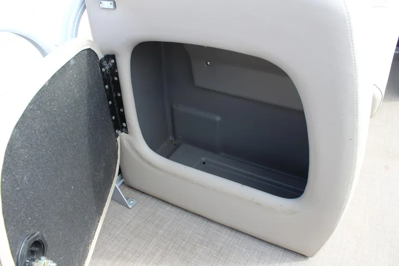 Slide: The Image of Open storage compartment on 2022 Sun Tracker Party Barge 18 DLX pontoon boat. - 16