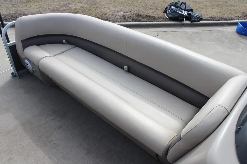 Slide: The Image of 2022 Sun Tracker Party Barge 18 DLX pontoon seating, beige upholstery, outdoor setting. - 17