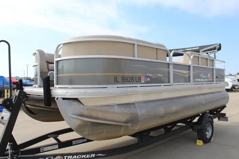 Slide: The Image of 2022 Sun Tracker Party Barge 18 DLX pontoon boat on trailer, side view. - 3