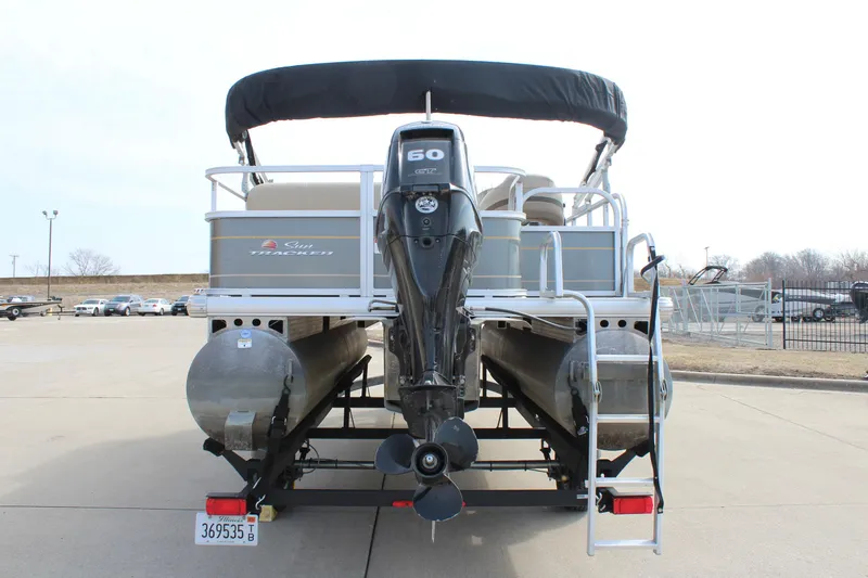 Slide: The Image of 2022 Sun Tracker Party Barge 18 DLX pontoon boat with outboard motor, rear view. - 6