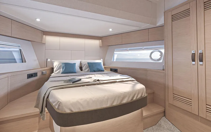 Slide: The Image of Luxurious cabin interior of 2026 Beneteau Swift Trawler 54 with modern design and cozy bedding. - 15