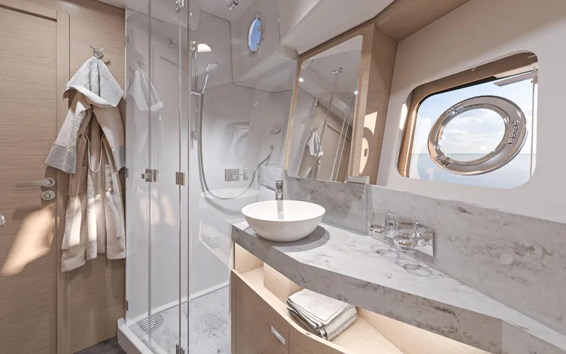 Slide: The Image of Luxurious bathroom in 2026 Beneteau Swift Trawler 54, featuring modern fixtures and elegant design. - 17