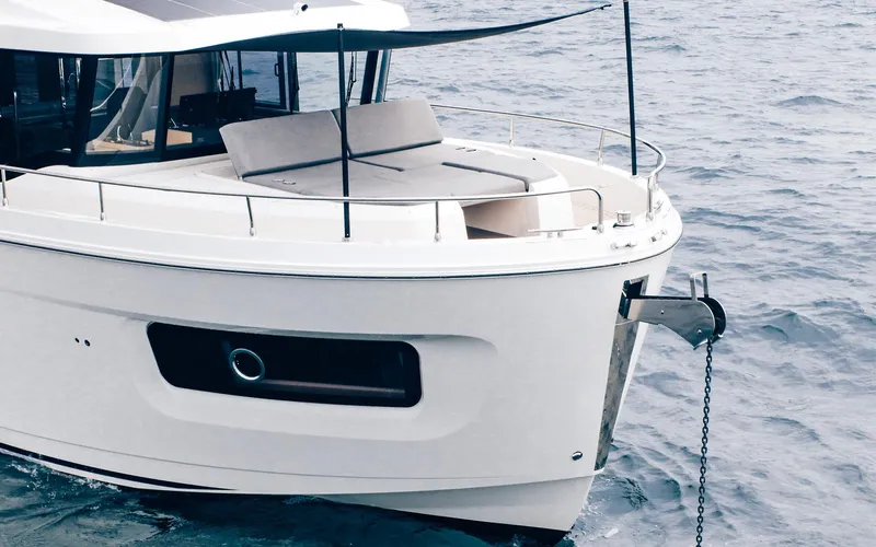Slide: The Image of 2026 Beneteau Swift Trawler 54 on water, showcasing sleek design and modern features. - 7