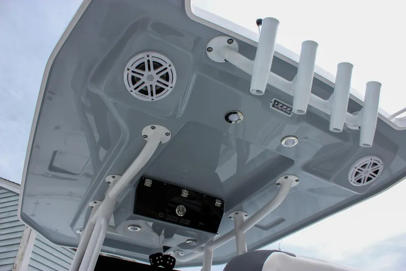 Slide: The Image of 2023 Blackfin 252 CC boat roof with speakers and rod holders. - 1