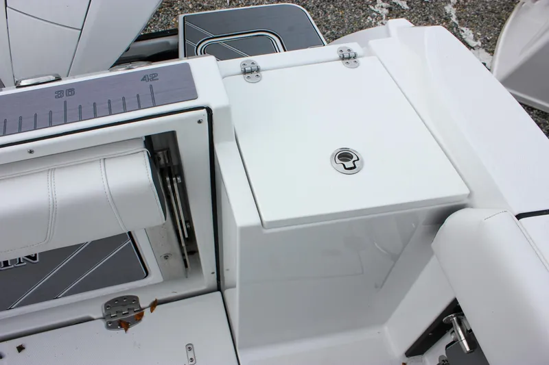 Slide: The Image of 2023 Blackfin 252 CC boat deck with storage compartment and seating. - 11