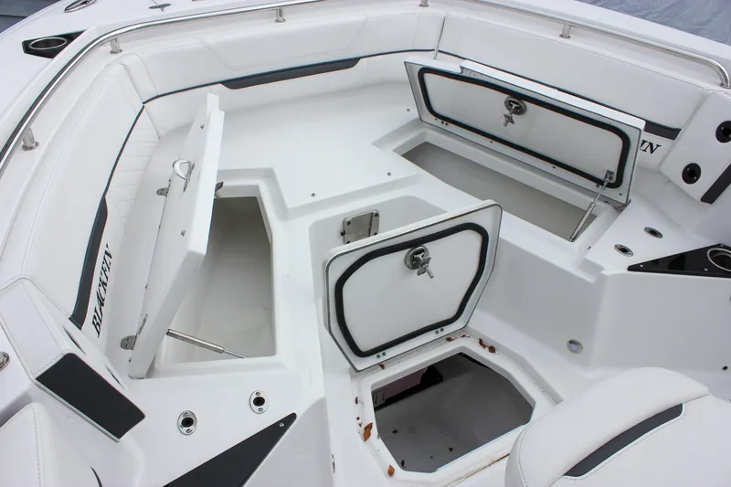 Slide: The Image of 2023 Blackfin 252 CC boat interior with open storage compartments. - 26