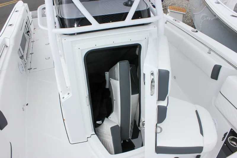 Slide: The Image of 2023 Blackfin 252 CC boat interior with seating and storage area. - 32