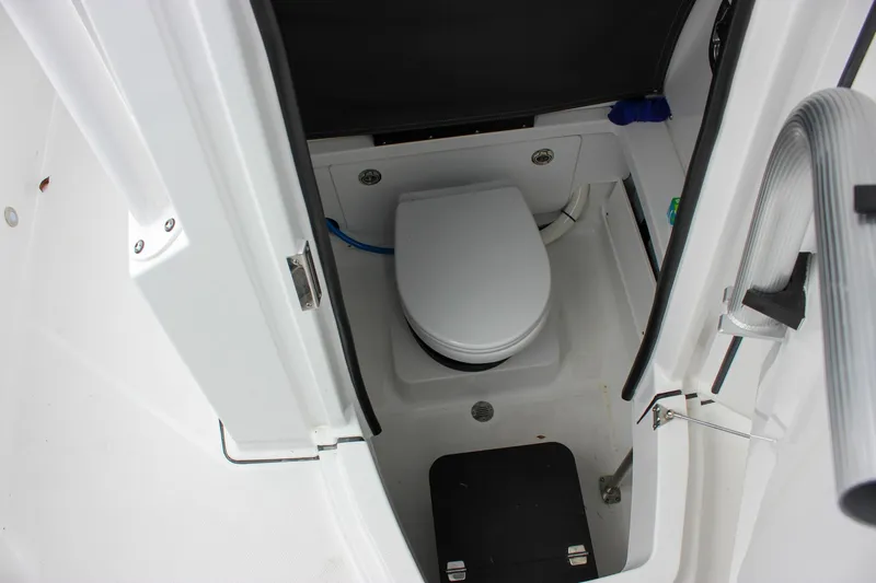 Slide: The Image of 2023 Blackfin 252 CC boat interior with compact marine toilet. - 33