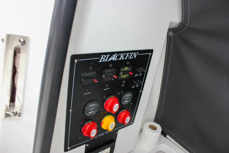 Slide: The Image of Control panel of 2023 Blackfin 252 CC boat with switches and dials. - 35