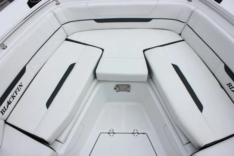 Slide: The Image of 2023 Blackfin 252 CC boat interior with white cushioned seating. - 38