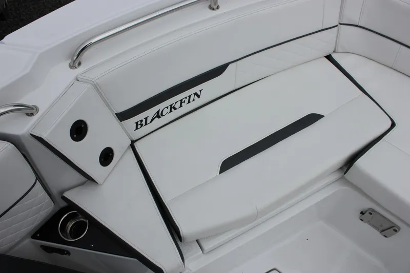 Slide: The Image of 2023 Blackfin 252 CC boat interior seating with sleek white and black design. - 39