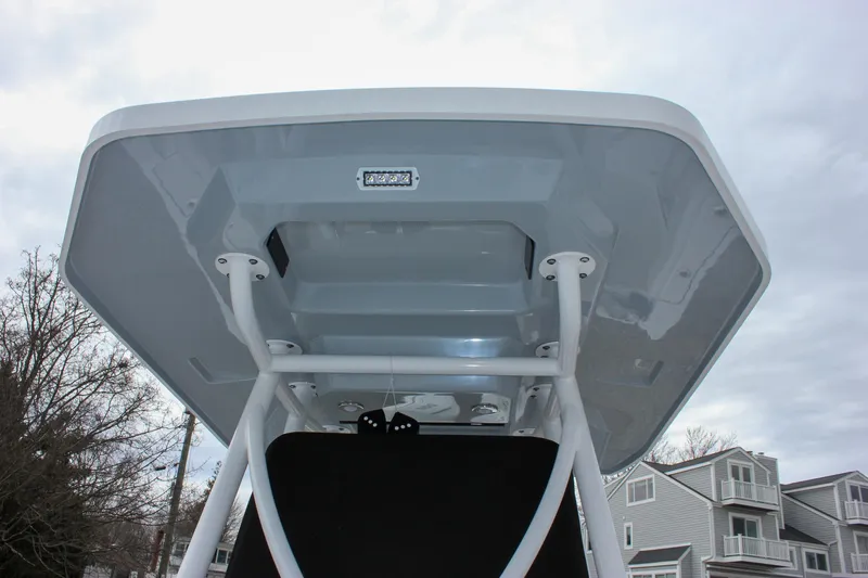 Slide: The Image of 2023 Blackfin 252 CC boat canopy viewed from below, showcasing sturdy construction. - 43