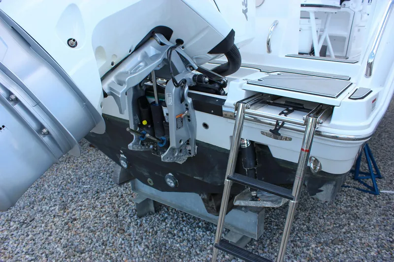 Slide: The Image of 2023 Blackfin 252 CC boat stern with ladder and engine mount detail. - 5
