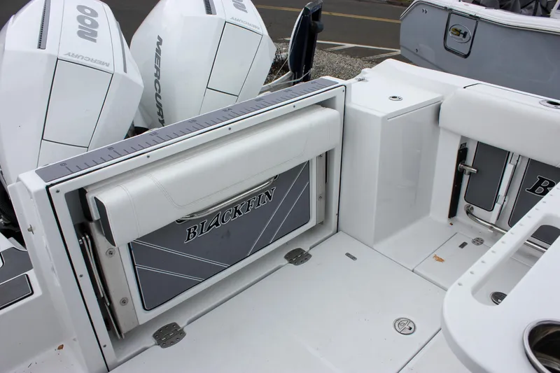 Slide: The Image of 2023 Blackfin 252 CC boat interior with seating and outboard engines. - 6