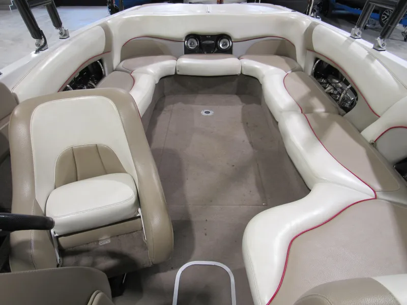 Slide: The Image of 2007 Malibu Wakesetter 247 LSV interior with beige and white seating. - 13
