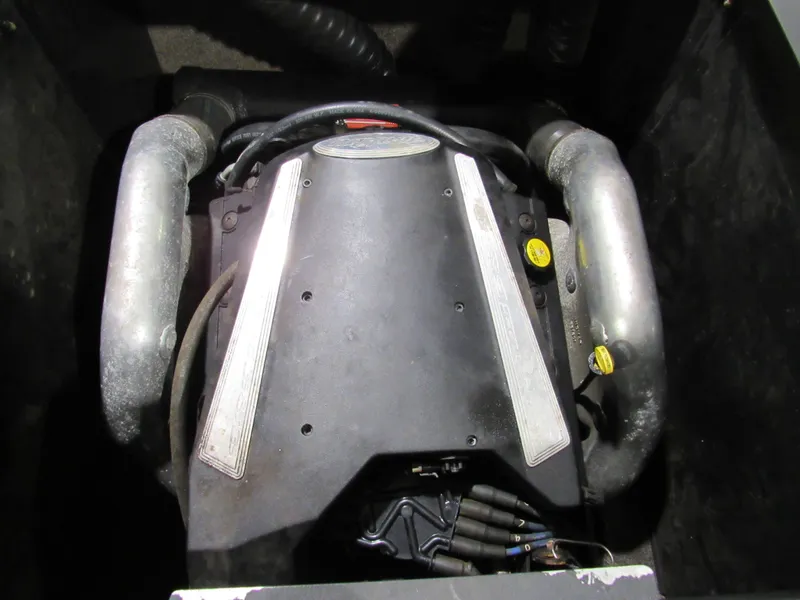 Slide: The Image of Engine compartment of 2007 Malibu Wakesetter 247 LSV boat, featuring metallic components. - 14