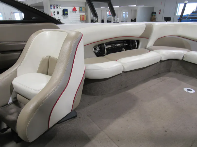 Slide: The Image of 2007 Malibu Wakesetter 247 LSV interior with beige and white seating. - 8