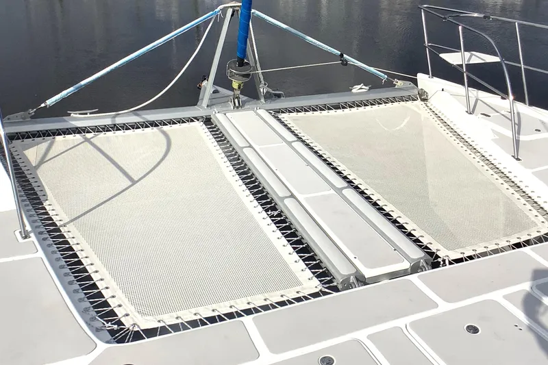 Slide: The Image of 2021 Royal Cape Catamarans Majestic 570 Flybridge with dual trampolines on deck. - 13