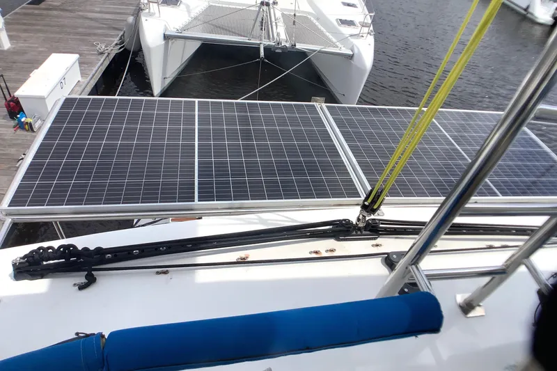 Slide: The Image of Solar panels on 2021 Royal Cape Catamarans Majestic 570 Flybridge, docked at marina. - 31