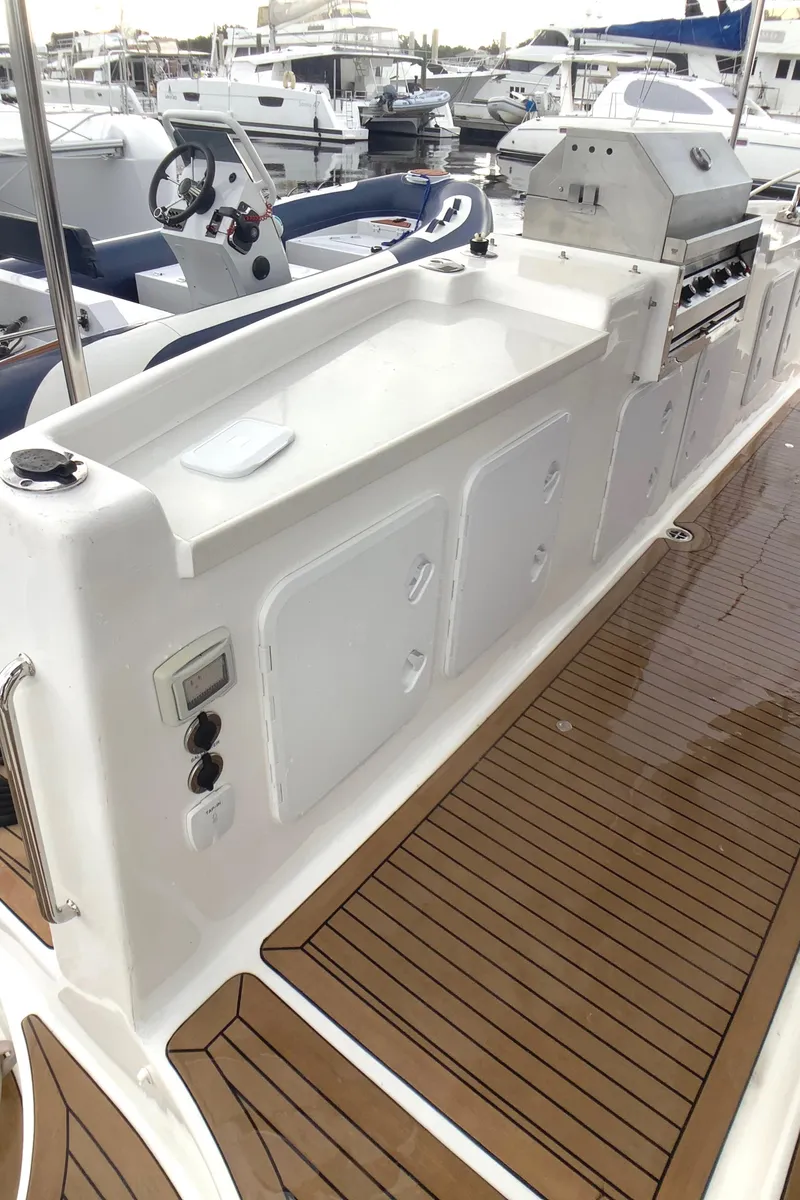 Slide: The Image of 2021 Royal Cape Catamarans Majestic 570 Flybridge with sleek deck and modern amenities. - 36