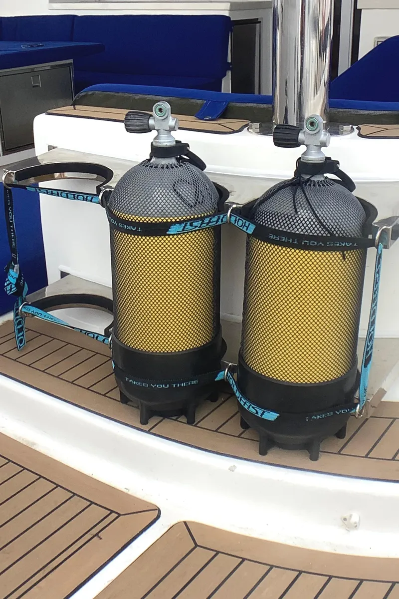 Slide: The Image of Two yellow scuba tanks secured on a Royal Cape Catamarans Majestic 570 Flybridge, 2021 model. - 37