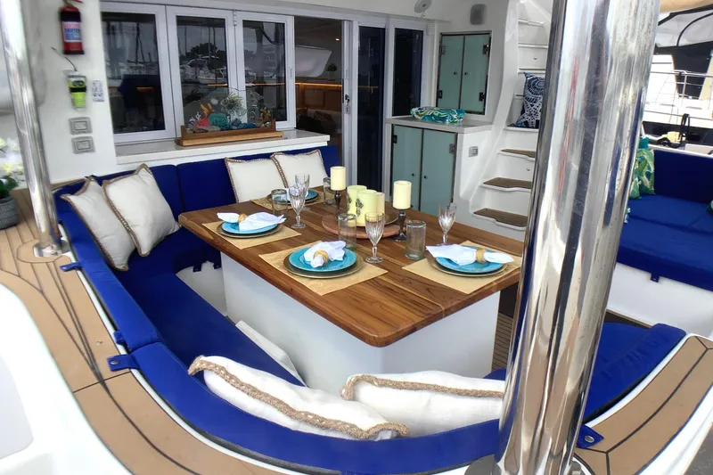 Slide: The Image of Luxurious dining area on 2021 Royal Cape Catamarans Majestic 570 Flybridge with elegant table setting. - 38