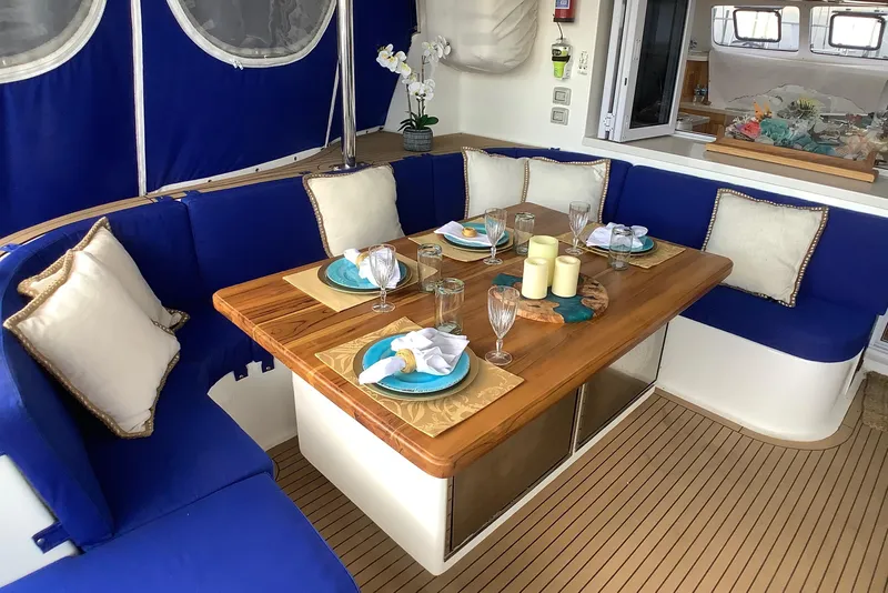Slide: The Image of Luxurious dining area on 2021 Royal Cape Catamarans Majestic 570 Flybridge with elegant table setting. - 44