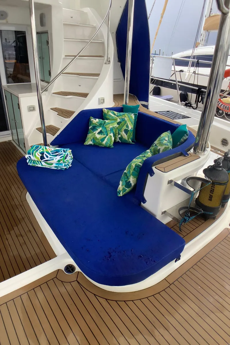 Slide: The Image of Luxurious seating area on 2021 Royal Cape Catamarans Majestic 570 Flybridge with blue cushions. - 45
