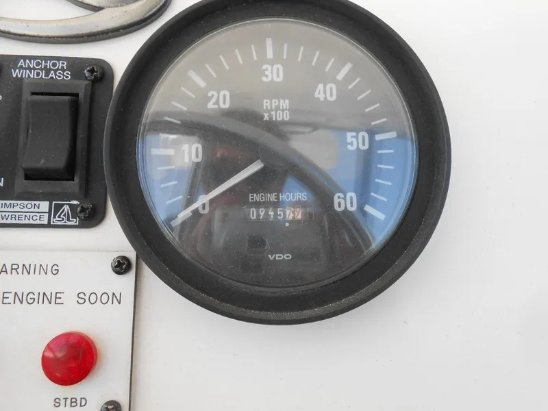 Slide: The Image of Close-up of 1999 Silverton 352 MY tachometer showing RPM and engine hours. - 6