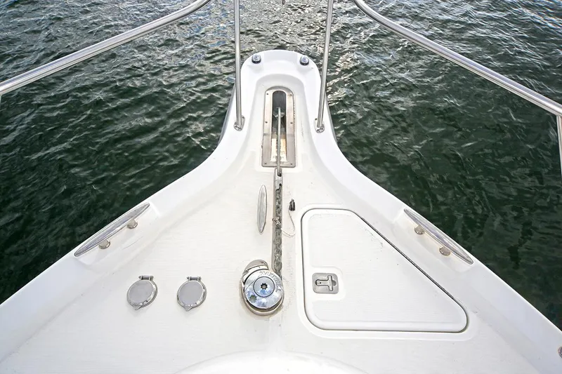 Slide: The Image of Bow of 2007 Tiara Yachts 3900 Sovran on water, featuring anchor and deck fittings. - 13