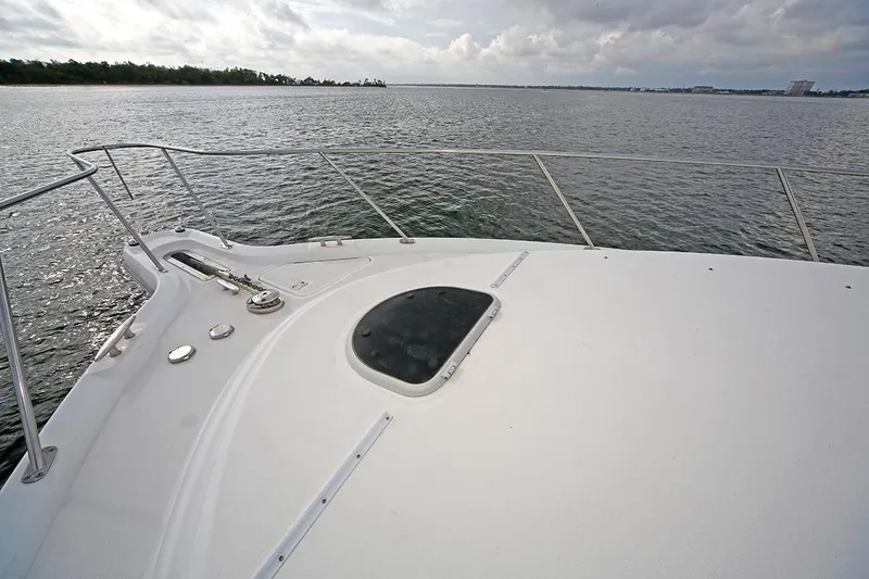Slide: The Image of 2007 Tiara Yachts 3900 Sovran bow view on calm water under cloudy sky. - 15