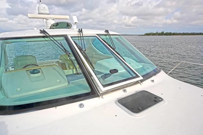 Slide: The Image of 2007 Tiara Yachts 3900 Sovran boat on water, showcasing windshield and cockpit. - 16