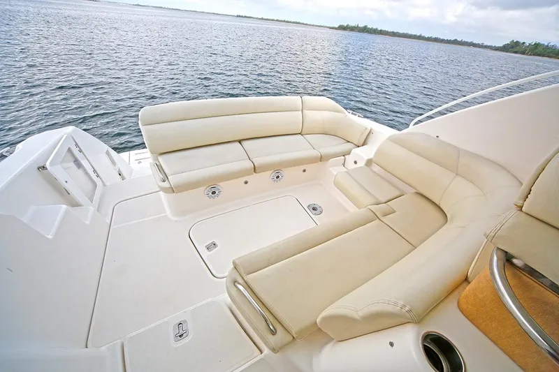 Slide: The Image of 2007 Tiara Yachts 3900 Sovran deck with beige seating, overlooking calm waters. - 28