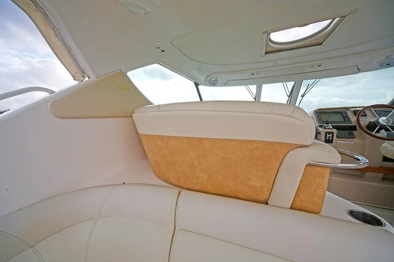 Slide: The Image of Interior of 2007 Tiara Yachts 3900 Sovran, featuring luxurious seating and helm area. - 30