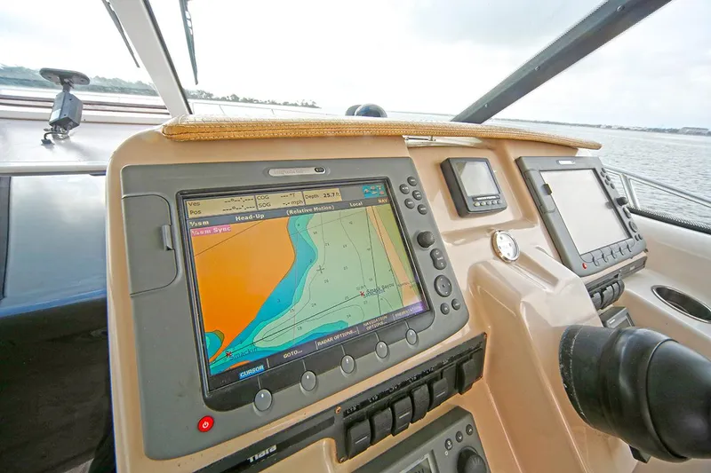 Slide: The Image of 2007 Tiara Yachts 3900 Sovran helm with navigation display and controls. - 34