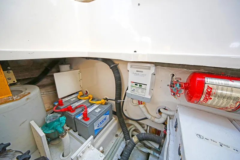 Slide: The Image of Engine room of 2007 Tiara Yachts 3900 Sovran with battery and fire extinguisher. - 39
