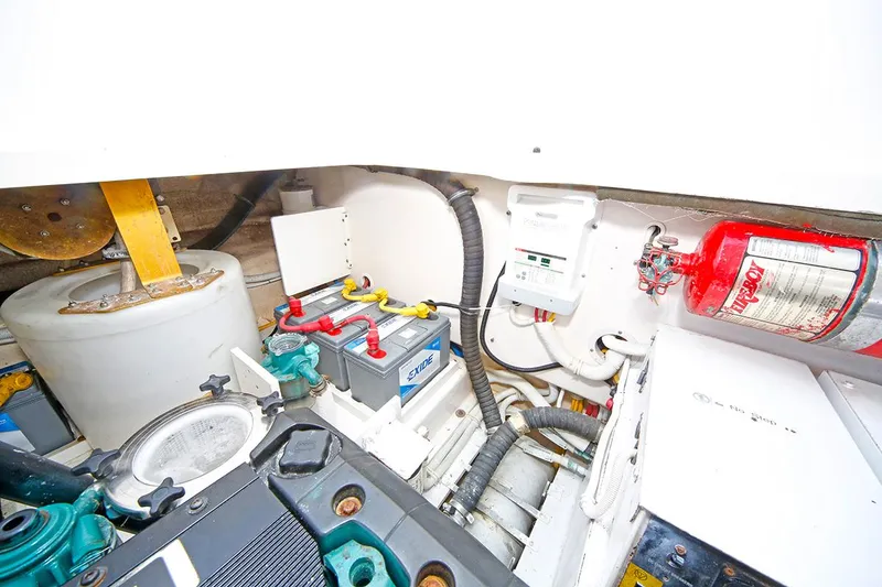 Slide: The Image of Engine compartment of a 2007 Tiara Yachts 3900 Sovran, featuring battery and fire extinguisher. - 40