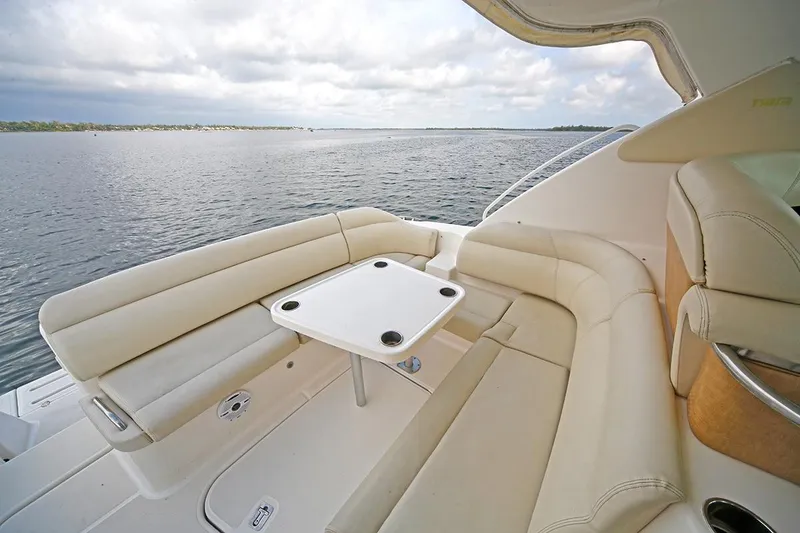 Slide: The Image of 2007 Tiara Yachts 3900 Sovran with elegant seating and table on open water. - 42