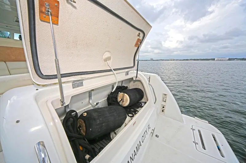 Slide: The Image of 2007 Tiara Yachts 3900 Sovran storage compartment open by the water. - 6