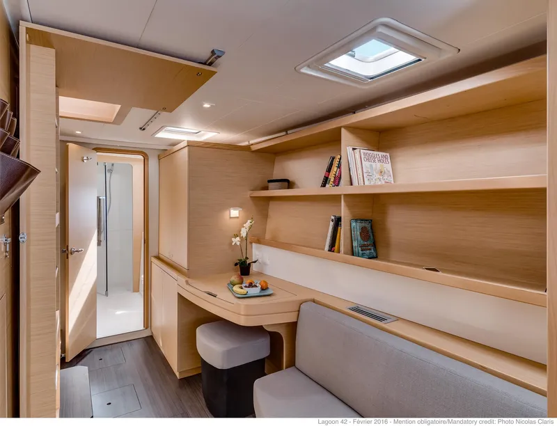 Slide: The Image of Modern interior of 2025 Lagoon 42 Millenium yacht with sleek design and cozy seating area. - 12