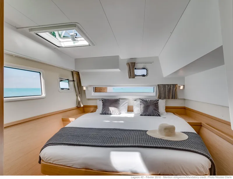 Slide: The Image of Luxurious bedroom interior of 2025 Lagoon 42 Millenium yacht with ocean view. - 13