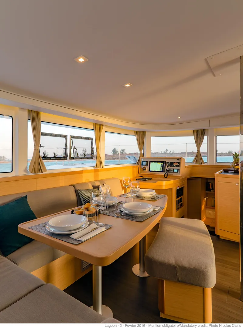 Slide: The Image of Luxurious interior of 2025 Lagoon 42 Millenium yacht with elegant dining area and navigation station. - 8