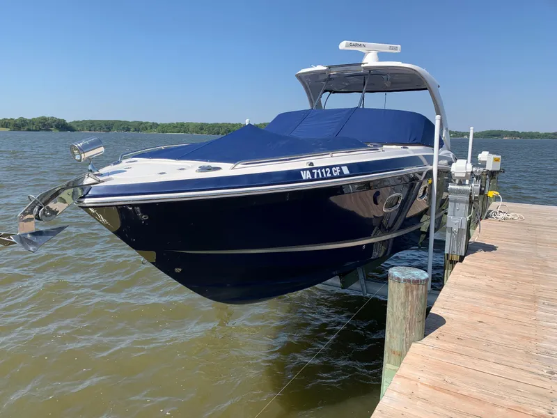 The Image of 2016 Chaparral 337SSX boat docked on a sunny day by the water. - 0