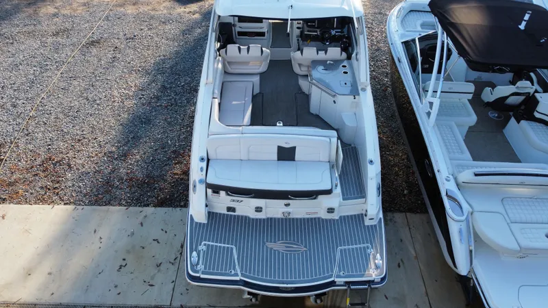Slide: The Image of 2016 Chaparral 337SSX boat, aerial view, showcasing spacious seating and deck layout. - 12