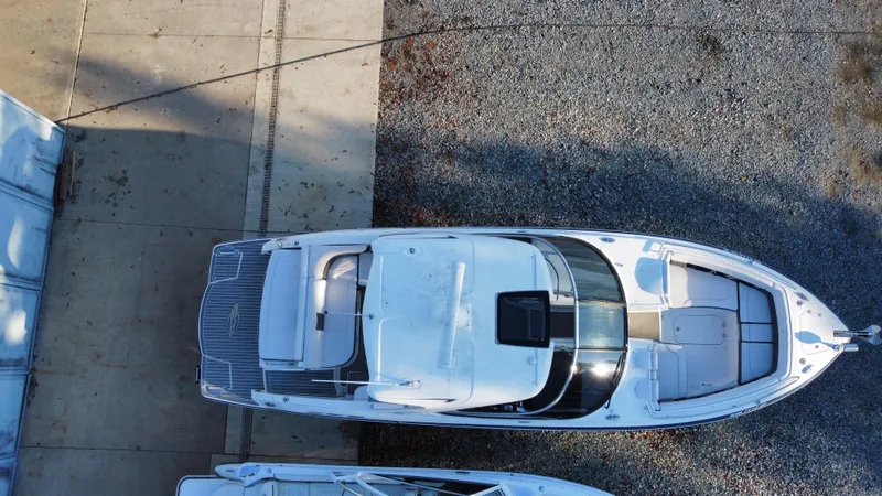 Slide: The Image of Overhead view of 2016 Chaparral 337SSX boat on gravel and concrete surface. - 13