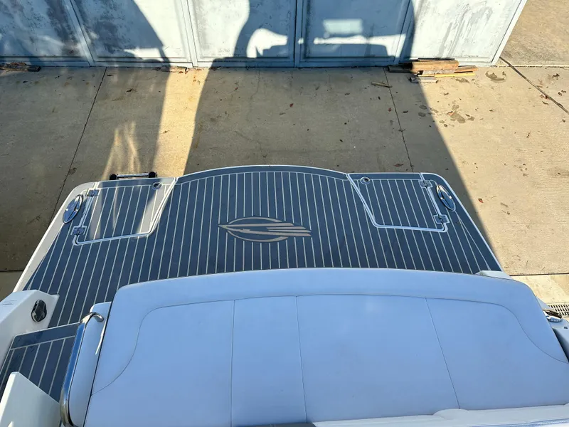 Slide: The Image of 2016 Chaparral 337SSX boat deck with sleek design and logo. - 15