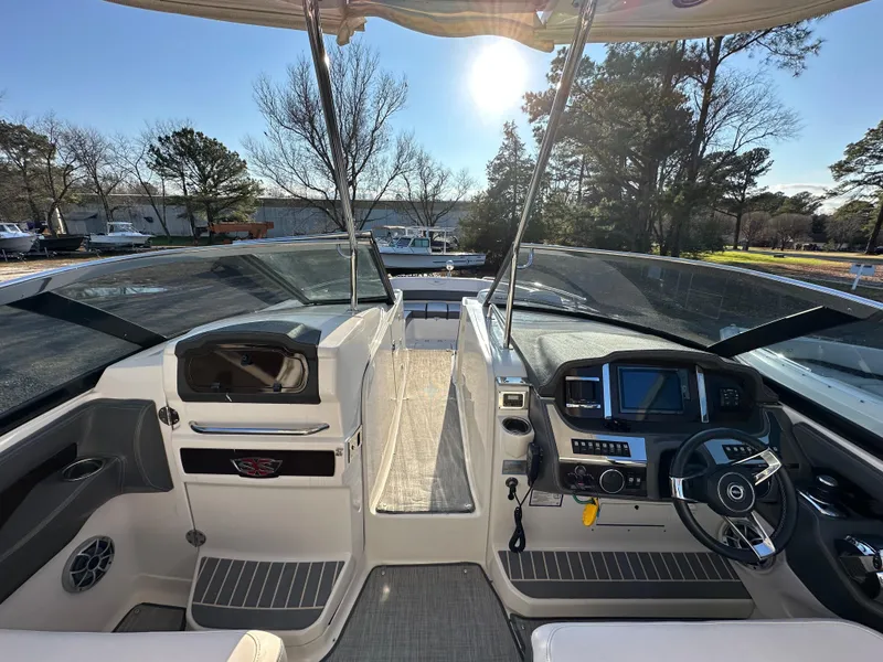 Slide: The Image of 2016 Chaparral 337SSX boat interior with modern dashboard and steering wheel. - 23