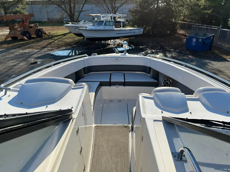 Slide: The Image of 2016 Chaparral 337SSX boat interior with seating and dashboard view. - 25