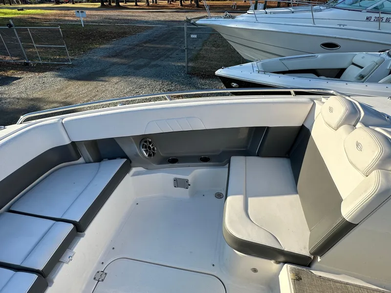 Slide: The Image of 2016 Chaparral 337SSX boat interior with white and gray seating. - 29